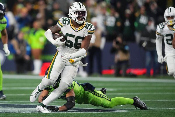 Green Bay Packers' Edgerrin Cooper intercepts a pass during the second half of an NFL football game against the Seattle Seahawks Sunday, Dec. 15, 2024, in Seattle. (AP Photo/Lindsey Wasson)