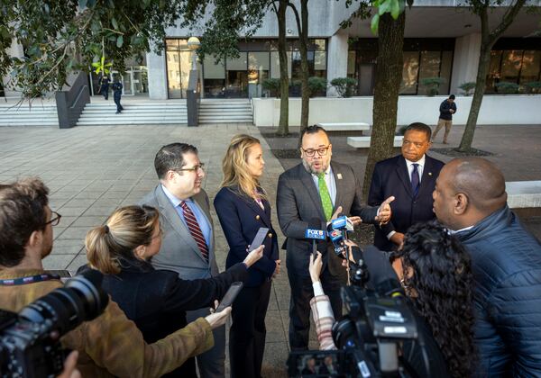 New Orleans City Council members, from left, Joseph Giarrusso III, Helena Moreno, Jean Paul "JP" Morrell, and Eugene Greene talk outside the Federal Courthouse, Tuesday, Jan. 14, 2025, in New Orleans, after a judge ruled the New Orleans Police Department can begin the process of ending longstanding federal oversight. (Chris Granger/The Times-Picayune/The New Orleans Advocate via AP)