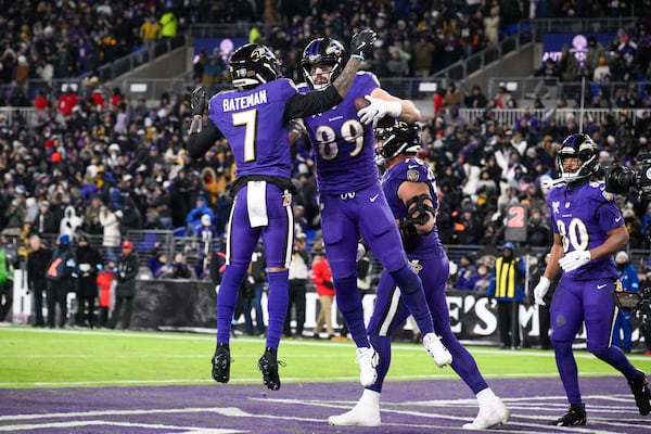 Baltimore Ravens tight end Mark Andrews (89) celebrates with wide receiver Rashod Bateman (7) after scoring a touchdown during the second half of an NFL football game against the Pittsburgh Steelers, Saturday, Dec. 21, 2024, in Baltimore. (AP Photo/Nick Wass)