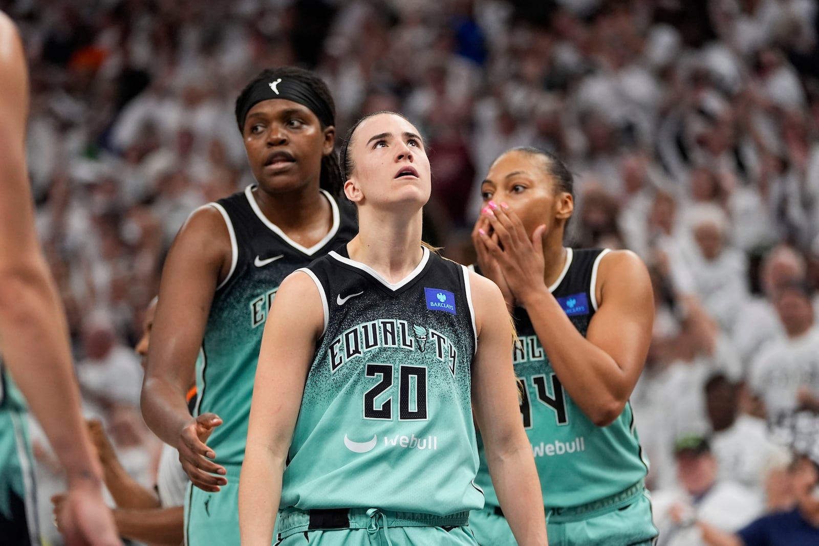 New York Liberty guard Sabrina Ionescu (20) reacts in the final minute against the Minnesota Lynx during the second half of Game 4 of a WNBA basketball final playoff series, Friday, Oct. 18, 2024, in Minneapolis. The Lynx won 82-80, forcing a Game 5 in the series. (AP Photo/Abbie Parr)