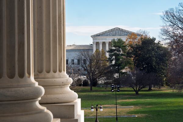 The Supreme Court is framed by the columns of the Capitol in Washington, Tuesday, Dec. 3, 2024. T (AP Photo/J. Scott Applewhite)