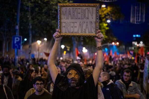 Demonstrators march to protest the skyrocketing cost of renting an apartment in Barcelona, Spain, Saturday, Nov. 23, 2024. (AP Photo/Emilio Morenatti)