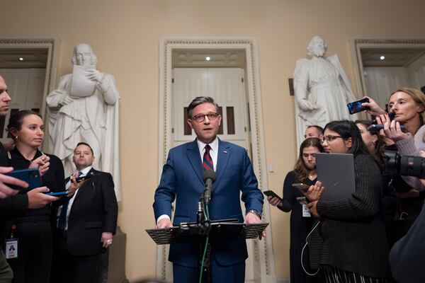 Speaker of the House Mike Johnson, R-La., talks briefly to reporters just before a vote on an interim spending bill to prevent a government shutdown, at the Capitol in Washington, Thursday, Dec. 19, 2024. The vote failed to pass. (AP Photo/J. Scott Applewhite)