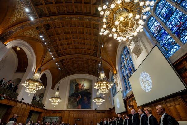 Judges at the International Court of Justice in The Hague, Netherlands, prepare to open hearings into what countries worldwide are legally required to do to combat climate change and help vulnerable nations fight its devastating impact, Monday, Dec. 2, 2024. (AP Photo/Peter Dejong)