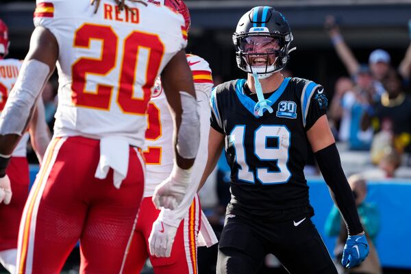 Carolina Panthers wide receiver Adam Thielen (19) speaks with Kansas City Chiefs safety Justin Reid (20) after a two-point conversion attempt during the second half of an NFL football game, Sunday, Nov. 24, 2024, in Charlotte, N.C. Reid was called for a persoanl foul against Thielen. (AP Photo/Rusty Jones)