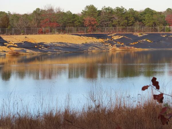 Water sits in a lined pit at the former Ciba-Geigy chemical plant on Dec. 17, 2024, in Toms River, N.J., one of America's most notorious toxic waste sites. (AP Photo/Wayne Parry)