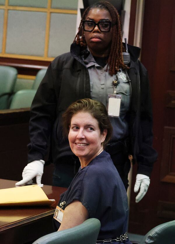 Sarah Boone smiles as she glances back at supporters in a courtroom of the Orange County Courthouse in Orlando, Florida, on Monday, Dec. 2, 2024, after she was sentenced to life in prison for murdering her boyfriend, Jorge Torres, Jr., in 2020 by suffocating him in a suitcase. (Stephen M. Dowell/Orlando Sentinel via AP)