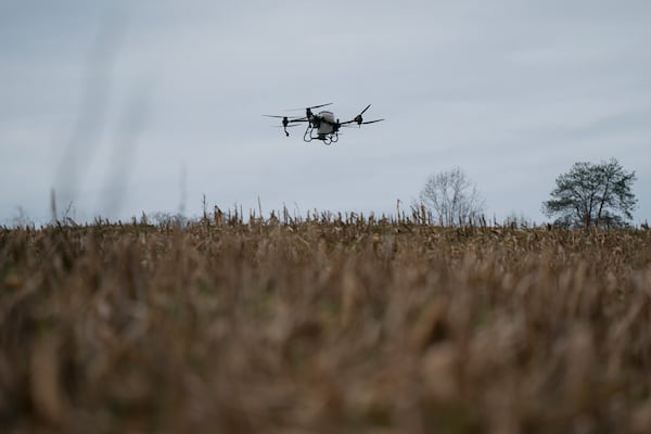 Russell Hedrick's DJI drone puts crop cover on his farm, Tuesday, Dec. 17, 2024, in Hickory, N.C. (AP Photo/Allison Joyce)