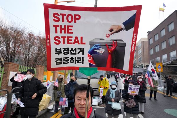 Supporters of impeached South Korean President Yoon Suk Yeol attend a rally to oppose his impeachment near the presidential residence in Seoul, South Korea, Monday, Jan. 6, 2025. (AP Photo/Ahn Young-joon)