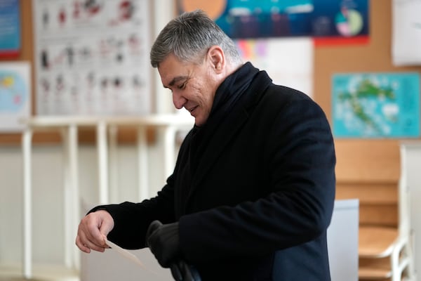 President incumbent Zoran Milanovic arrives to cast his ballot during a runoff vote for the Croatian presidential election at a polling station in Zagreb, Croatia, Sunday, Jan. 12, 2025. (AP Photo/Darko Bandic)