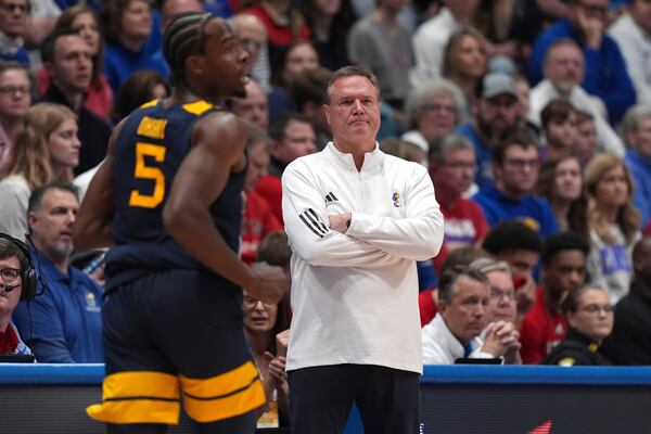 Kansas head coach Bill Self watches during the first half of an NCAA college basketball game against West Virginia, Tuesday, Dec. 31, 2024, in Lawrence, Kan. (AP Photo/Charlie Riedel)