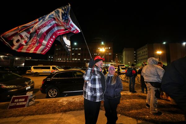 Supporters of President Donald Trump gather outside the DC Central Detention Facility, Monday, Jan. 20, 2025, in Washington. (AP Photo/Julio Cortez)