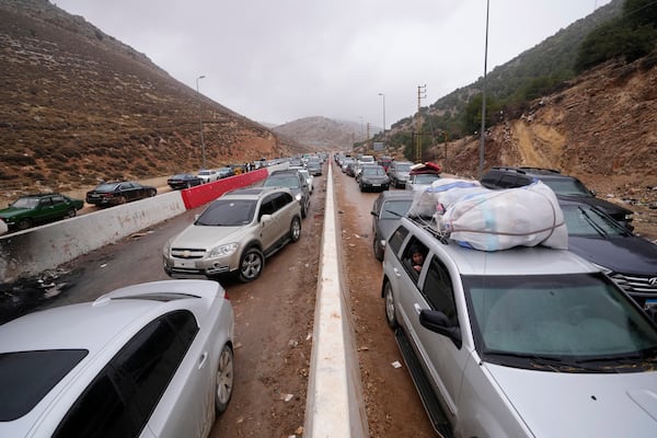 Displaced residents return from Syria at the Masnaa border crossing, eastern Lebanon, following a ceasefire between Israel and Hezbollah on Wednesday, Nov. 27, 2024. (AP Photo/Hassan Ammar)