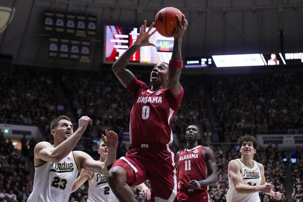 Alabama guard Labaron Philon (0) shoots over Purdue forward Camden Heide (23) during the first half of an NCAA college basketball game in West Lafayette, Ind., Friday, Nov. 15, 2024. (AP Photo/Michael Conroy)