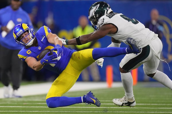 Los Angeles Rams wide receiver Cooper Kupp, left, is tackled by Philadelphia Eagles safety C.J. Gardner-Johnson during the second half of an NFL football game in Inglewood, Calif., Sunday, Nov. 24, 2024. (AP Photo/Mark J. Terrill)