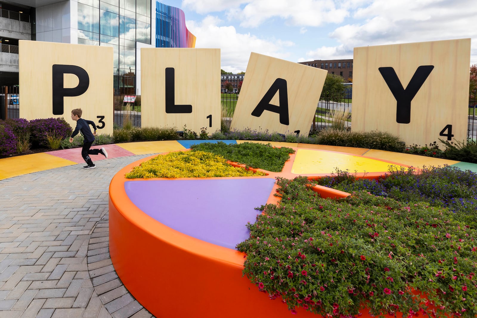 Large scrabble letters line the outdoor Hasbro Game Park at The Strong National Museum of Play, Tuesday, Oct. 15, 2024, in Rochester, N.Y. (AP Photo/Lauren Petracca)