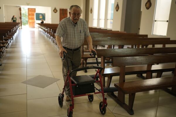 Spanish Jesuit Priest Jose Maria Blanch, who headed the multi-faith Churches Committee, walks around in the Cristo Rey parish in Asuncion, Paraguay, Tuesday, Oct. 29, 2024. During the Stroessner dictatorship, the group provided legal advice for prisoners, financial support for those freed and information for families with loved ones detained. (AP Photo/Jorge Saenz)