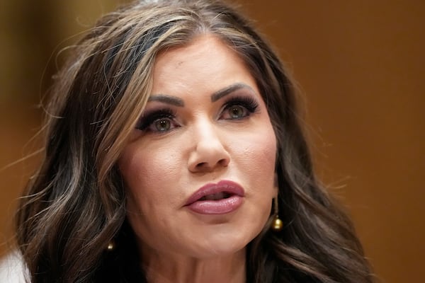 South Dakota Gov. Kristi Noem, President-elect Donald Trump's nominee to be Secretary of Homeland Security, appears before the Senate Homeland Security and Governmental Affairs Committee for her confirmation hearing, at the Capitol in Washington, Friday, Jan. 17, 2025. (AP Photo/Ben Curtis)