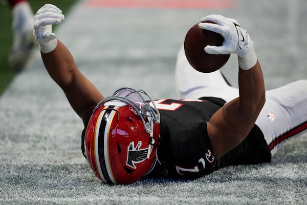 Atlanta Falcons running back Bijan Robinson (7) reacts to being tackled just short of the goal line in the second half of an NFL football game against the New York Giants in Atlanta, Sunday, Dec. 22, 2024. (AP Photo/Mike Stewart)