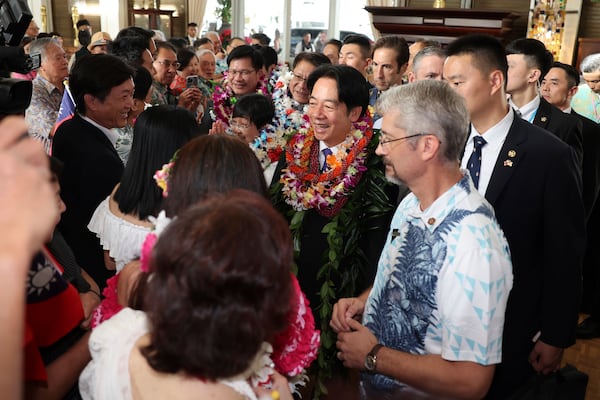 Taiwan President Lai Ching-te, center, greets people at the Kahala Hotel and Resort Saturday, Nov. 30, 2024 in Honolulu. (AP Photo/Marco Garcia)