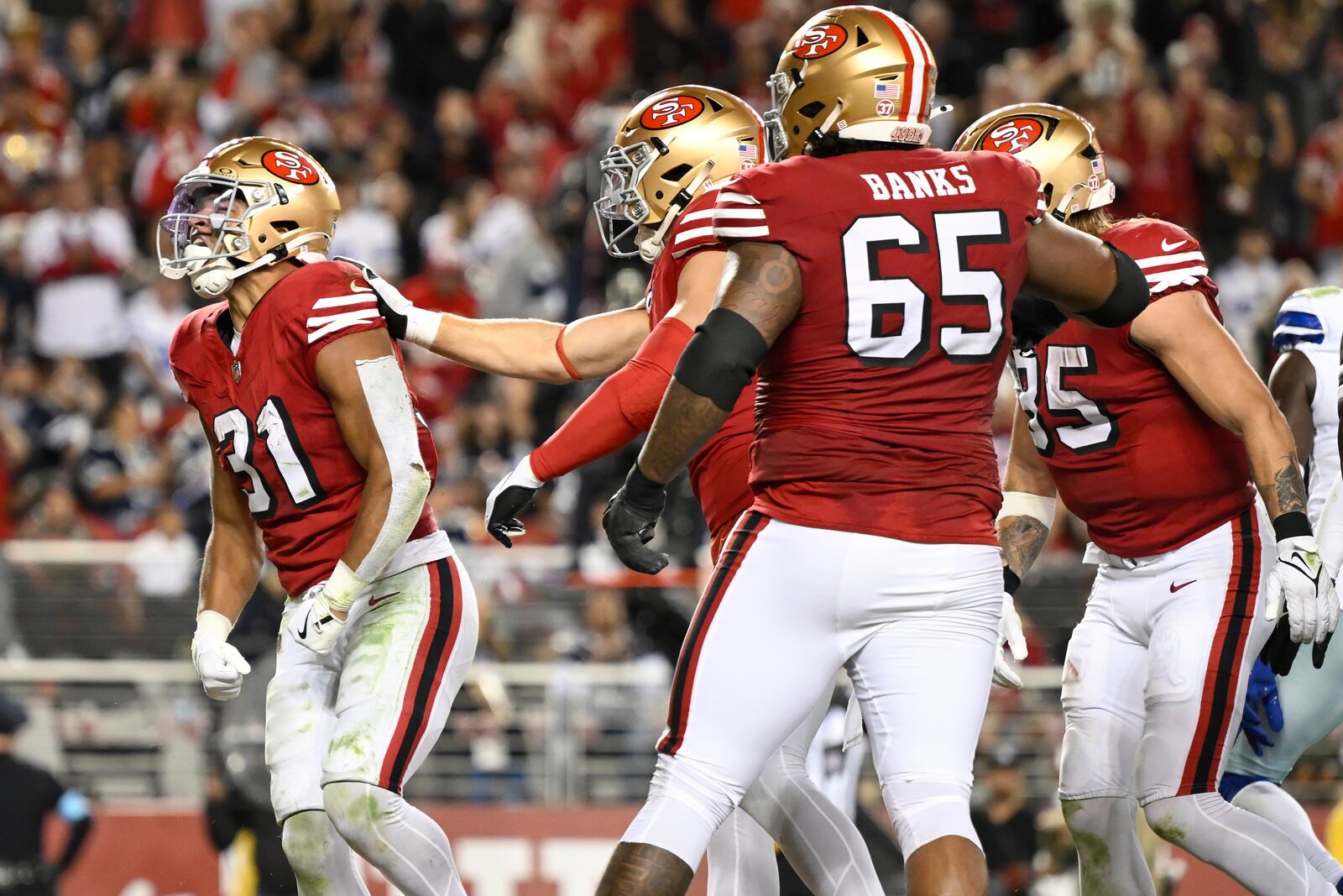 San Francisco 49ers running back Isaac Guerendo (31) celebrates after scoring against the Dallas Cowboys during the second half of an NFL football game in Santa Clara, Calif., Sunday, Oct. 27, 2024. (AP Photo/Eakin Howard)