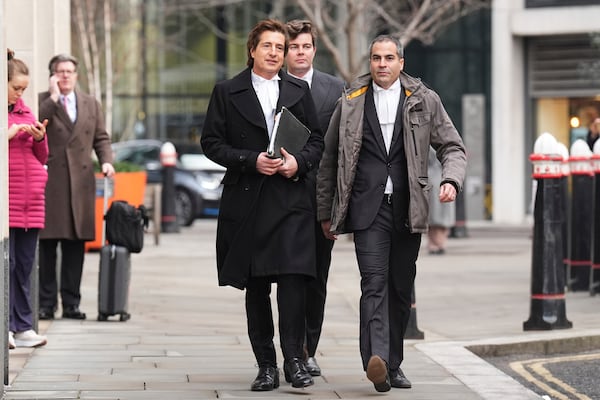 Lawyer David Sherborne, left, arrives at the High Court as Prince Harry's legal action against News Group Newspapers over allegations of unlawful information gathering begins in London, Tuesday, Jan. 21, 2025. (AP Photo/Alastair Grant)