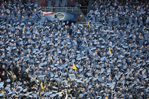 Cadets celebrate during the first half of an NCAA college football game against Navy, Saturday, Dec. 14, 2024, in Landover, Md. (AP Photo/Daniel Kucin Jr.)