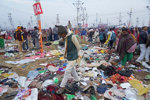 Hindu devotees search for their belongings after a stampede when Hindu devotees rushed to take a holy bath in the Sangam, the confluence of the Ganges, the Yamuna and the mythical Saraswati rivers, on "Mauni Amavasya" or new moon day during the Maha Kumbh festival in Prayagraj, India, Wednesday, Jan. 29, 2025. (AP Photo/Deepak Sharma)