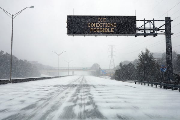 Heavy snow and ice on Interstate 110 on Tuesday, Jan. 21, 2025, in Pensacola, Fla. (Luis Santana/Tampa Bay Times via AP)