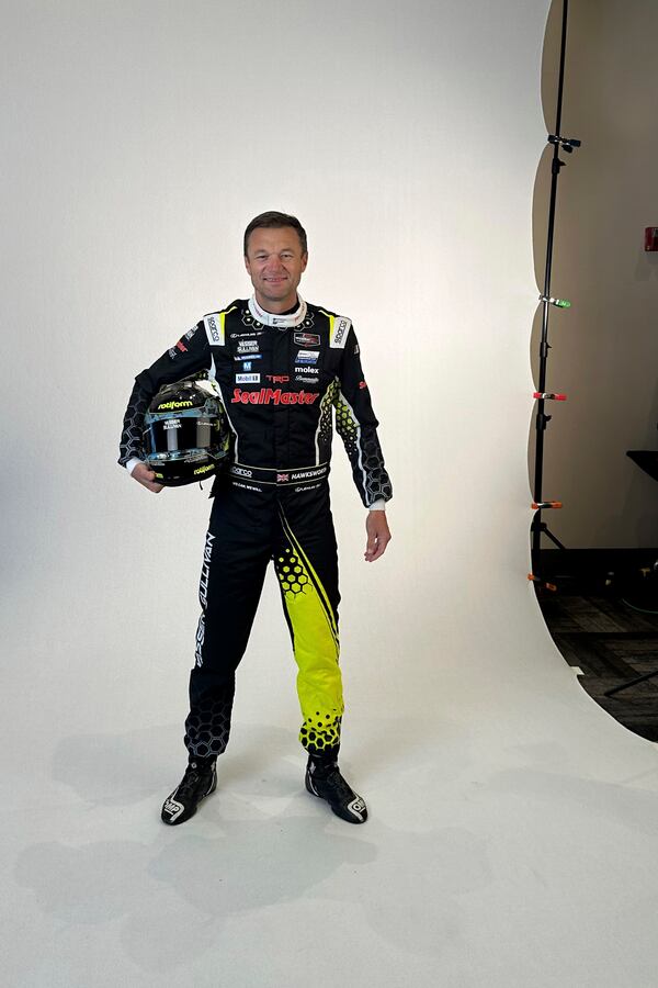 Race car driver and NBC/Fox Sports analyst poses for photos Thursday Jan. 16, 2025 at Daytona International Speedway in Florida. (AP Photo/Jenna Fryer)