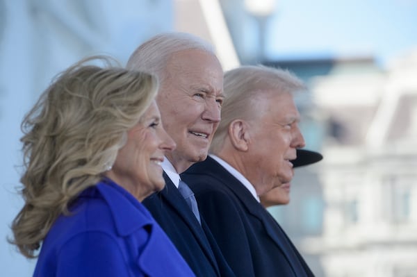 President Joe Biden looks on as he and first lady Jill Biden welcome President-elect Donald Trump and Melania Trump on the North Portico of the White House in Washington, Monday, Jan. 20, 2025. (AP Photo/Rod Lamkey, Jr.)