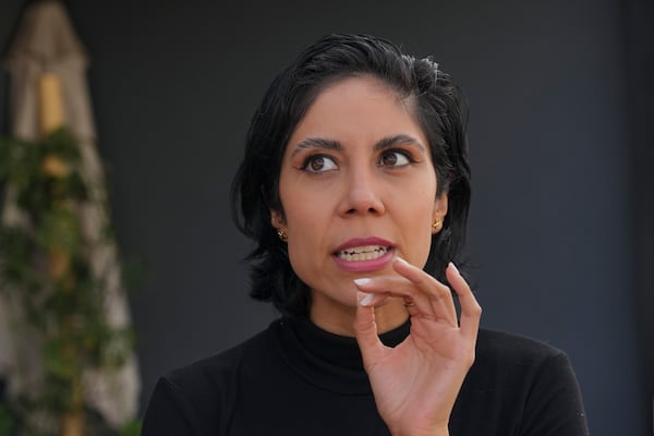 Mexican film critic Gaby Meza talks about the film Emilia Perez during an interview in Mexico City, Thursday, Jan. 16, 2025. (AP Photo/Marco Ugarte)