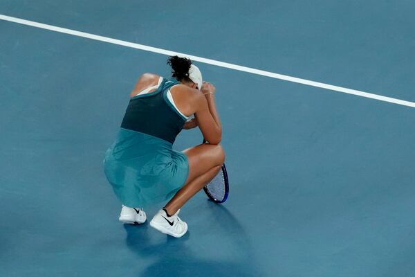 Madison Keys of the U.S. reacts after defeating Iga Swiatek of Poland during their semifinal match at the Australian Open tennis championship in Melbourne, Australia, early Friday, Jan. 24, 2025. (AP Photo/Manish Swarup)