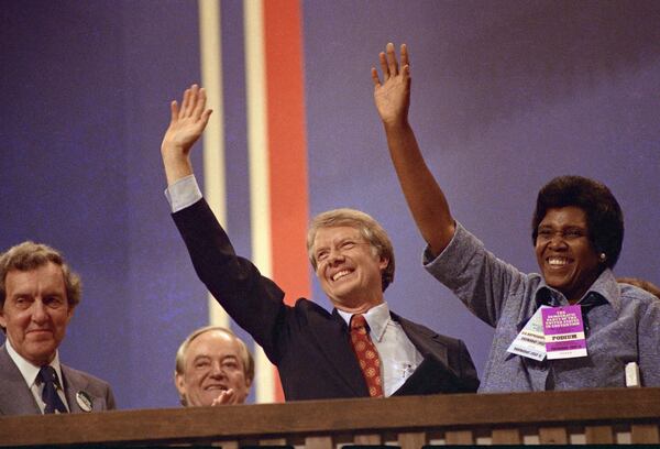 FILE - Democratic presidential candidate Jimmy Carter and Rep. Barbara Jordan, D-Texas, wave at the Democratic National Convention in New York's Madison Square Garden where Jordan gave a speech on July 12, 1976. (AP Photo)