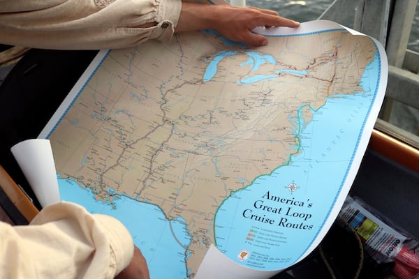 Peter Frank holds a map Thursday, Nov. 7, 2024, of the Great Loop, a 6,000-mile journey he is trying to complete in a canoe, during a stop in Annapolis, Md. (AP Photo/Brian Witte)