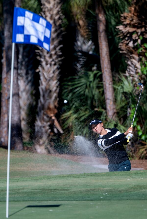 Jean Thitkul hits from the rough on the sixth green during the first round of the LPGA CME Group Tour Championship golf tournament Thursday, Nov. 21, 2024, in Naples, Fla. (AP Photo/Chris Tilley)