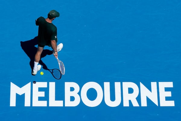 Tommy Paul of the U.S. prepares to serve to Roberto Carballes Baena of Spain during their third round match at the Australian Open tennis championship in Melbourne, Australia, Friday, Jan. 17, 2025. (AP Photo/Manish Swarup)