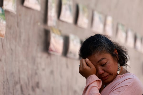 A relative of a victim of a 2004 Indian Ocean tsunami shows an expression during its 20th anniversary at Tsunami Memorial Park at Ban Nam Khem, Takuapa district of Phang Nga province, southern Thailand, Thursday, Dec. 26, 2024. (AP Photo/Wason Wanichakorn)