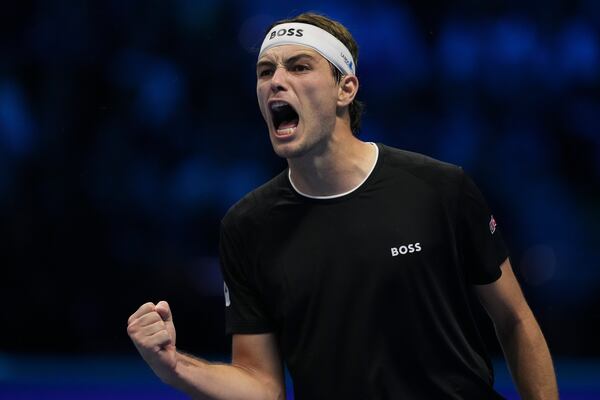 Taylor Fritz of the United States celebrates after winning the ATP World Tour Finals semifinal tennis match against Germany's Alexander Zverevat at the Inalpi Arena in Turin, Italy, Saturday, November 16, 2024. (AP Photo/Antonio Calanni)