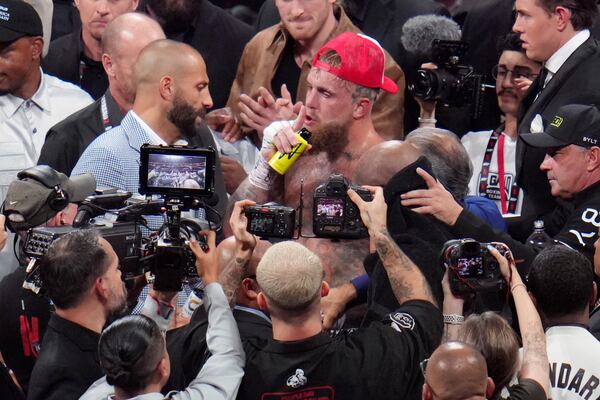 Jake Paul reacts after defeating Mike Tyson during their heavyweight boxing match, Friday, Nov. 15, 2024, in Arlington, Texas. (AP Photo/Julio Cortez)