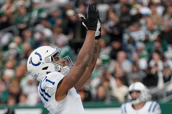 Indianapolis Colts wide receiver Josh Downs (1) reacts after scoring a touchdown against the New York Jets during the fourth quarter of an NFL football game, Sunday, Nov. 17, 2024, in East Rutherford, N.J. (AP Photo/Seth Wenig)