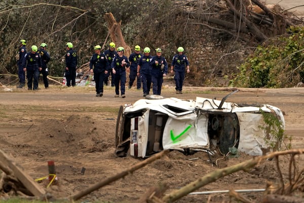 FILE - Personnel from Urban Search and Rescue Utah Task Force 1 work in the aftermath of Hurricane Helene, Oct. 4, 2024, in Erwin, Tenn. (AP Photo/Jeff Roberson, File)