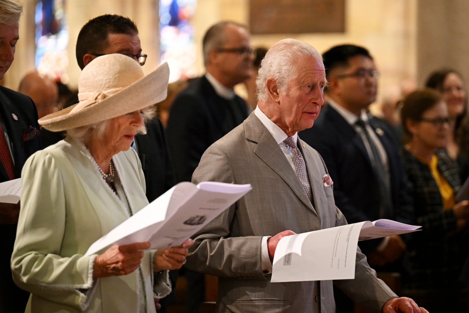 King Charles III, right, and Queen Camilla, left, stand during a visit to St Thomas' Anglican Church in Sydney, Sunday, Oct. 20, 2024. (Dean Lewins/Pool Photo via AP)