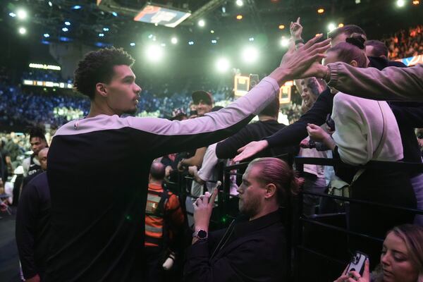 San Antonio Spurs center Victor Wembanyama (1) greets fans following a Paris Games 2025 NBA basketball game against the Indiana Pacers in Paris, Saturday, Jan. 25, 2025. (AP Photo/Thibault Camus)