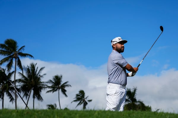 J.J. Spaun hits from the second teeduring the final round of the Sony Open golf event, Sunday, Jan. 12, 2025, at Waialae Country Club in Honolulu. (AP Photo/Matt York)