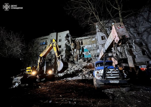 In this photo provided by the Ukrainian Emergency Services on Nov. 19, 2024, rescue workers clear the rubble of a residential building destroyed by a Russian strike in Hlukhiv, Ukraine. (Ukrainian Emergency Service via AP)