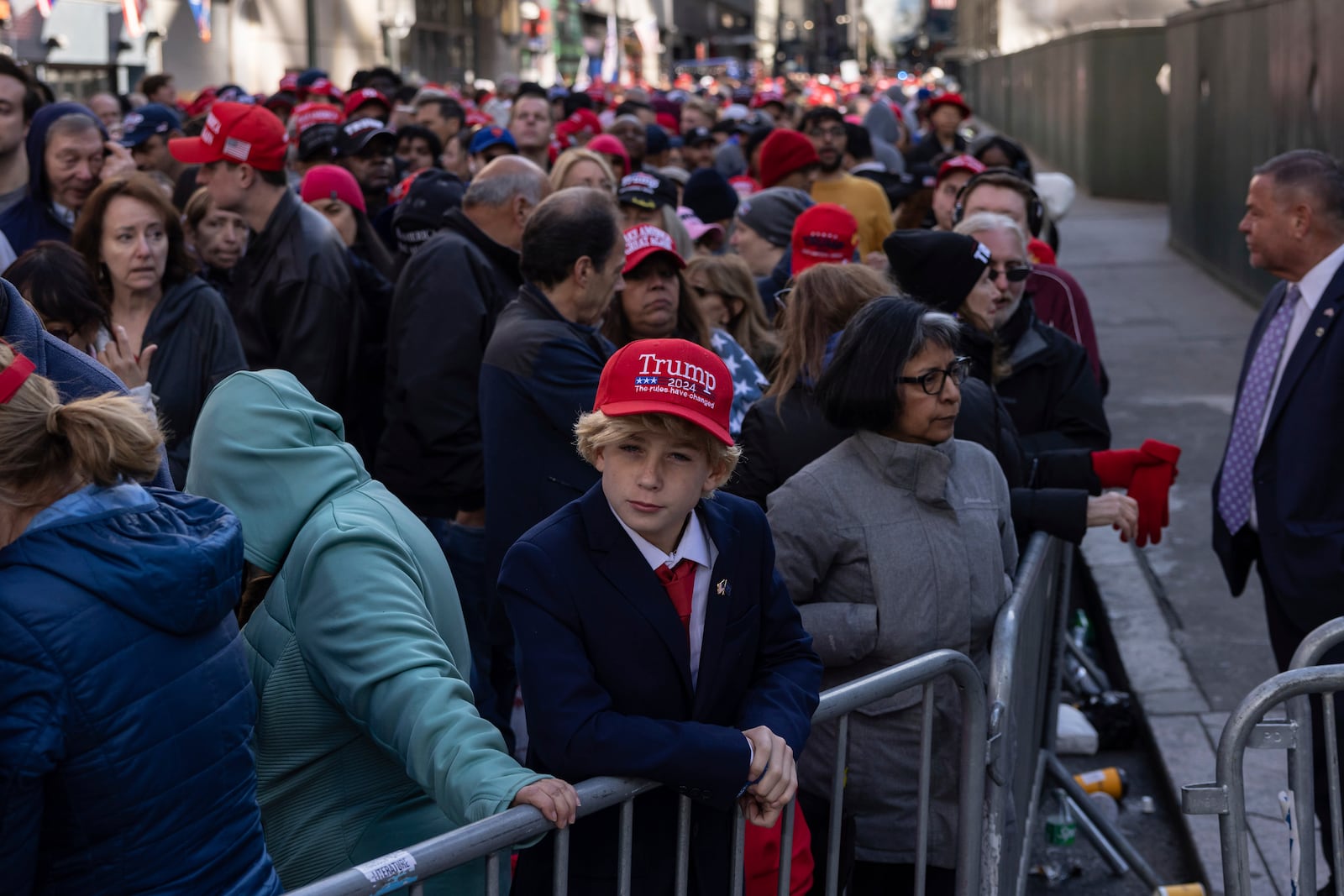 Supporters of Republican presidential nominee former President Donald Trump gather for his campaign rally outside Madison Square Garden, Sunday, Oct. 27, 2024, in New York. (AP Photo/Yuki Iwamura)