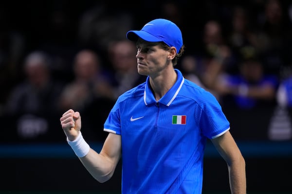 Italy's Jannik Sinner reacts winning a point as he plays Netherlands' Tallon Griekspoor during the Davis Cup final tennis match between Netherlands and Italy at the Martin Carpena Sports Hall in Malaga, southern Spain, Sunday, Nov. 24, 2024. (AP Photo/Manu Fernandez)