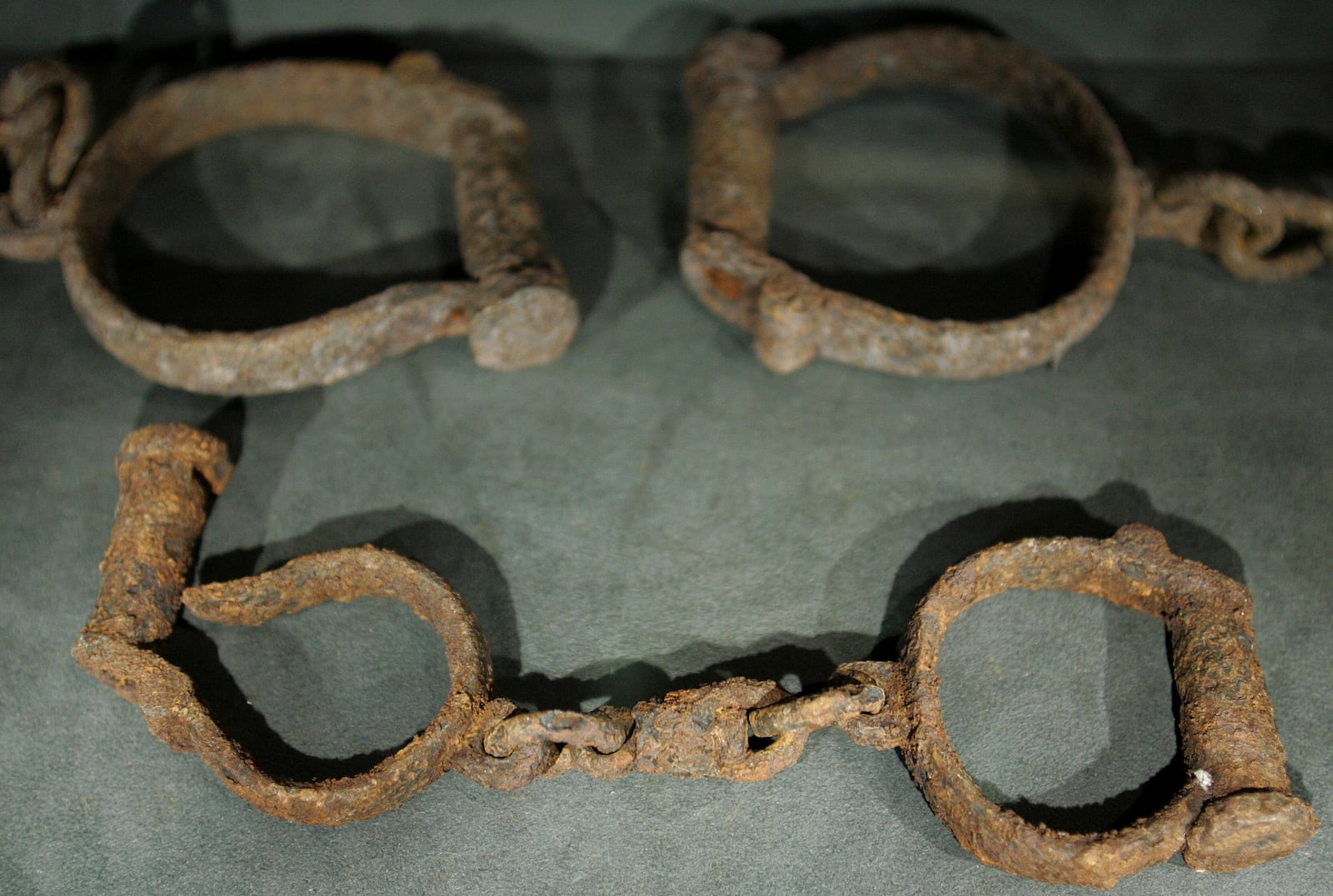 FILE - Sets of shackled used in the transportation of slaves, on display at the new International Slavery Museum in Liverpool, England, Friday Aug 17, 2007. (AP Photo/Dave Thompson, File)