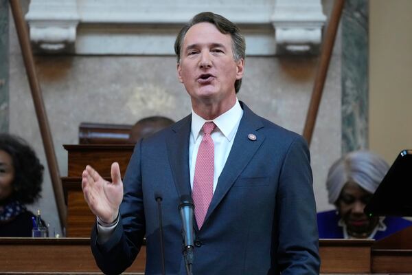 FILE - Virginia Gov. Glenn Youngkin gestures as he delivers his annual State of the Commonwealth address before a joint session of the Virginia General Assembly at the Capitol, Jan. 13, 2025 in Richmond, Va. (AP Photo/Steve Helber, file)